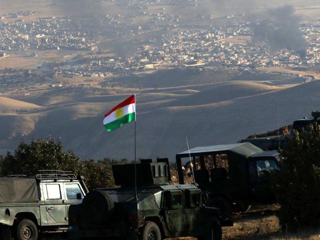 Iraqi Kurdish forces are seen stationed on a hill top as smoke billows during an operation by them (backed by US-led strikes) in the northern Iraqi town of Sinjar. (AFP) Iraqi Kurdish forces are seen stationed on a hill top as smoke billows during an operation by them (backed by US-led strikes) in the northern Iraqi town of Sinjar. (AFP)