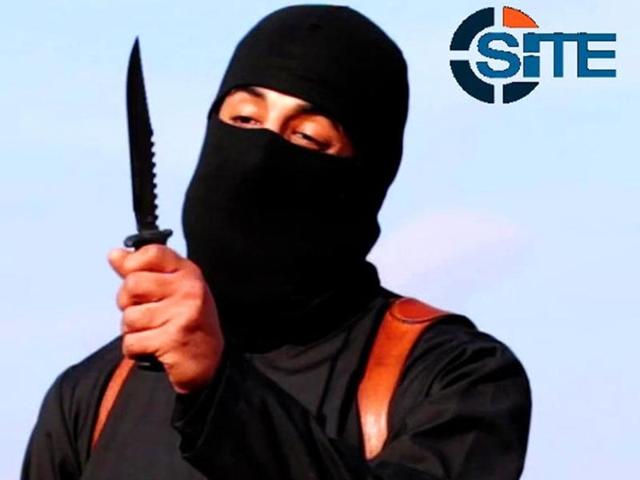 A masked, black-clad militant, who had been identified as a Briton named Mohammed Emwazi, brandishes a knife in this still image from a 2014 video obtained from SITE Intel Group. (Reuters) A masked, black-clad militant, who had been identified as a Briton named Mohammed Emwazi, brandishes a knife in this still image from a 2014 video obtained from SITE Intel Group. (Reuters)