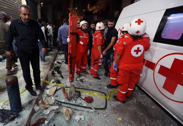 Lebanese Red Cross responders stand near the site of a twin suicide attack in Burj al-Barajneh, southern Beirut, Lebanon. (AP Photo) Lebanese Red Cross responders stand near the site of a twin suicide attack in Burj al-Barajneh, southern Beirut, Lebanon. (AP Photo)