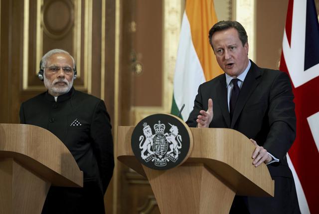 Prime Minister Narendra Modi (L) stands with Britains Prime Minister David Cameron during a joint news conference at the Foreign Office. (REUTERS) Prime Minister Narendra Modi (L) stands with Britains Prime Minister David Cameron during a joint news conference at the Foreign Office. (REUTERS)