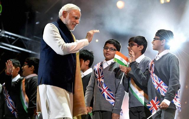 Prime Minister Narendra Modi interact with school childrens at Wembley Stadium for addressing Indian Community in London on Friday. (PTI) Prime Minister Narendra Modi interact with school childrens at Wembley Stadium for addressing Indian Community in London on Friday. (PTI)