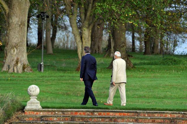 Prime Minister Narendra Modi and his British counterpart David Cameroon walk in the garden at the latter's official residence at Chequers, Wendover in London on Friday. (PTI)