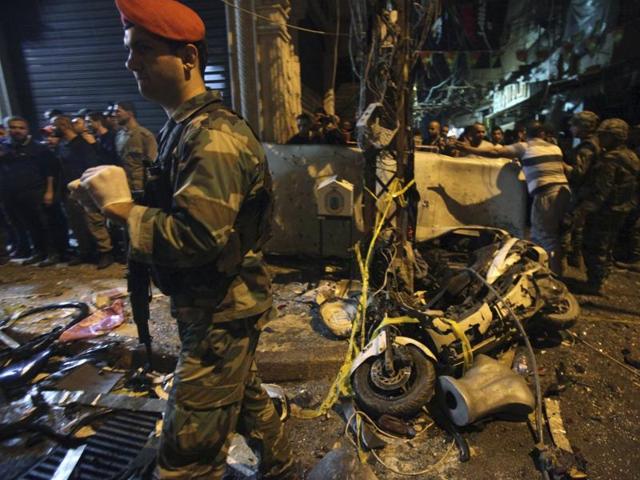 A man walks near a blood stain in a damaged area caused by two explosions in Beirut's southern suburbs, Lebanon. (Reuters Photo) A man walks near a blood stain in a damaged area caused by two explosions in Beirut's southern suburbs, Lebanon. (Reuters Photo)