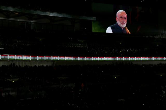Prime Minister Narendra Modi is seen on a large screen as he takes part in an event at Wembley Stadium, in London. (REUTERS) Prime Minister Narendra Modi is seen on a large screen as he takes part in an event at Wembley Stadium, in London. (REUTERS)