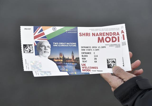 A man shows off his tickets on his way to Wembley Stadium which will host an event attended by Prime Minister Narendra Modi, in London (REUTERS) A man shows off his tickets on his way to Wembley Stadium which will host an event attended by Prime Minister Narendra Modi, in London (REUTERS)