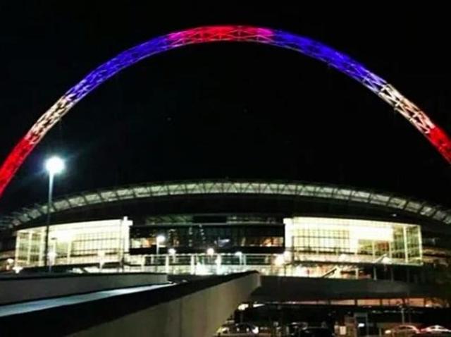 Wembley stadium’s arch in London lit up in colours of the French flag. (Photo courtesy: Twitter)