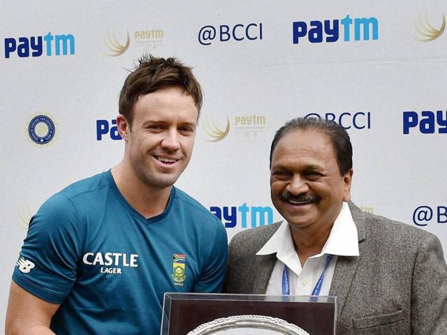 Before the start of the match, AB de Villiers is felicitated by BCCI Vice President G Gangaraju on the occasion of his 100th Test. (PTI Photo)