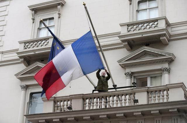 An embassy worker moves the French flag to half mast in tribute to victims of Paris attacks, at the French embassy in London. (Reuters) An embassy worker moves the French flag to half mast in tribute to victims of Paris attacks, at the French embassy in London. (Reuters)
