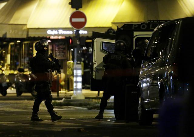 Police officers of the armed response unit man a position close to the Bataclan theatre after a series of gun attacks occurred across Paris. (AFP Photo)