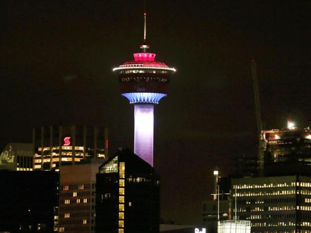 The Calgary Tower was lit up with the colors of the French flag to show support and sympathy regarding the Paris attacks in Calgary, Alberta. (AP Photo)