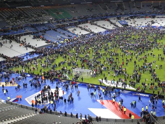 Spectators invade the pitch of the Stade de France stadium after the international friendly soccer France against Germany. (AP)