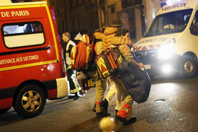 A victim is evacuated after the attack, near the Bataclan theatre in Paris. (AP) A victim is evacuated after the attack, near the Bataclan theatre in Paris. (AP)