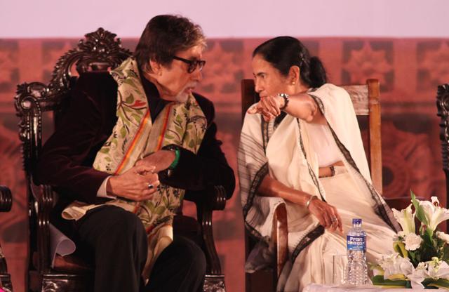 Amitabh Bachchan interacts with Chief Minister Mamata Banerjee during the inauguration ceremony of the 21st Kolkata International Film Festival at Netaji Indoor Stadium in Kolkata. (Subhankar Chakraborty/HT Photo)