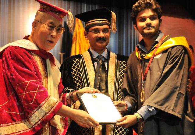 Nobel prize winner Dalai Lama Tenzin Gyatso confers degree to M Tech student Akash Gupta during convocation . (HT Photo ) Nobel prize winner Dalai Lama Tenzin Gyatso confers degree to M Tech student Akash Gupta during convocation . (HT Photo )