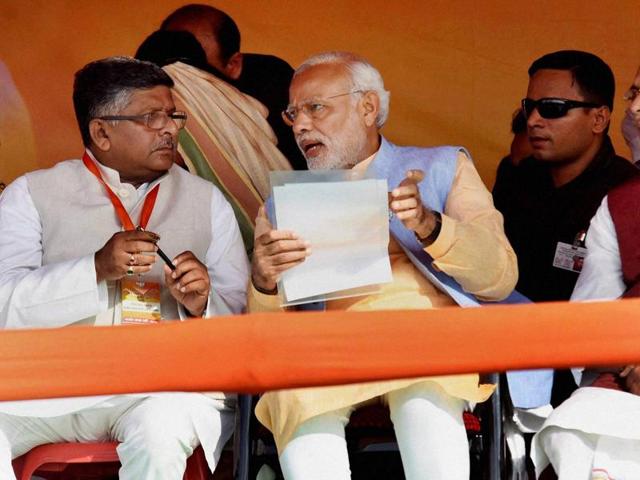 Prime Minister Narendra Modi with Union telecom minister Ravi Shankar Prasad and Union agriculture minister Radha Mohan Singh during an election rally in Darbhanga. (PTI Photo) Prime Minister Narendra Modi with Union telecom minister Ravi Shankar Prasad and Union agriculture minister Radha Mohan Singh during an election rally in Darbhanga. (PTI Photo)