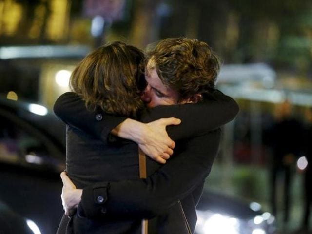 People hug on the street near the Bataclan concert hall following fatal attacks in Paris. (Reuters) People hug on the street near the Bataclan concert hall following fatal attacks in Paris. (Reuters)