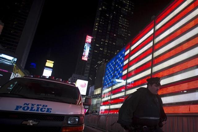 A New York police officer walks from a van that was deployed in Times Square to bolster security after the attacks in Paris, in the Manhattan borough of New York November 13, 2015. (Reuters) A New York police officer walks from a van that was deployed in Times Square to bolster security after the attacks in Paris, in the Manhattan borough of New York November 13, 2015. (Reuters)