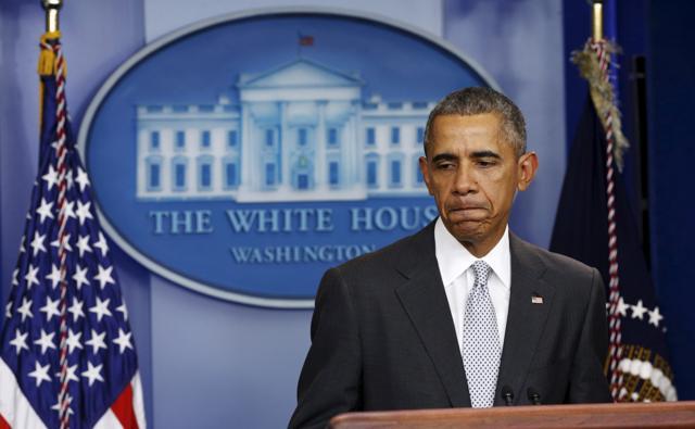 US President Barack Obama pauses while speaking about the shooting attacks in Paris, from the White House in Washington. (Reuters)