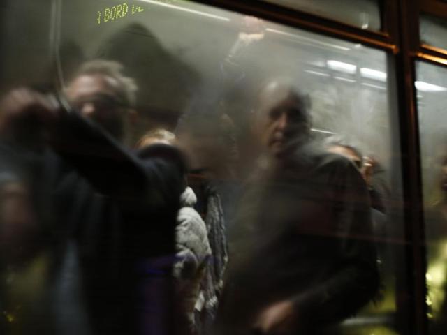 People are evacuated by bus, near the Bataclan concert hall in central Paris. (AFP)