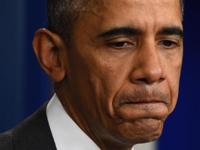 US President Barack Obama looks down as he speaks to the press in Washington, DC after the deadly Paris attacks.(AFP)