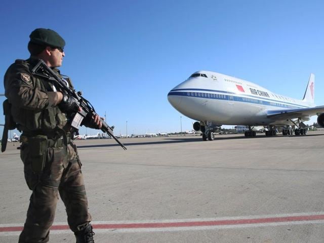 A security personnel looks on as a plane transporting China's President arrives at the Antalya International Airport before the G20 summit. (AFP Photo) A security personnel looks on as a plane transporting China's President arrives at the Antalya International Airport before the G20 summit. (AFP Photo)