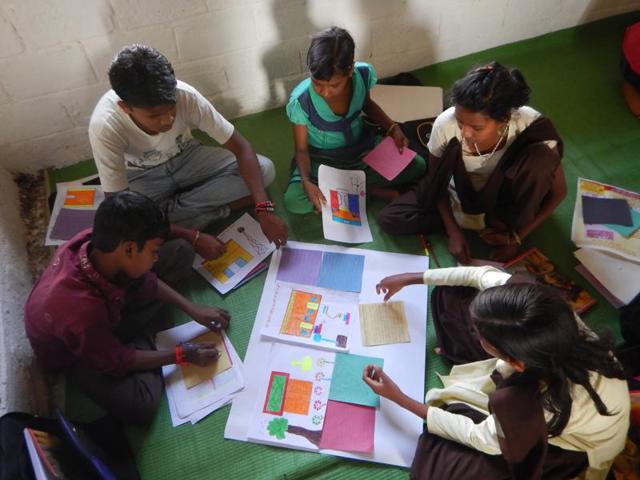 Tribal children from remote Patalkot in Chhindwara district engage in developing material for the wallpaper ‘Guiyyan’. (HT photo) Tribal children from remote Patalkot in Chhindwara district engage in developing material for the wallpaper ‘Guiyyan’. (HT photo)