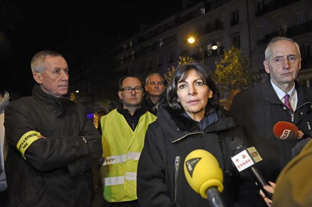Paris mayor Anne Hidalgo (C), flanked by Paris prosecutor Francois Molins (L) and Paris Police prefect Michel Cadot, addresses reporters near the Bataclan concert hall in central Paris. (AFP) Paris mayor Anne Hidalgo (C), flanked by Paris prosecutor Francois Molins (L) and Paris Police prefect Michel Cadot, addresses reporters near the Bataclan concert hall in central Paris. (AFP)
