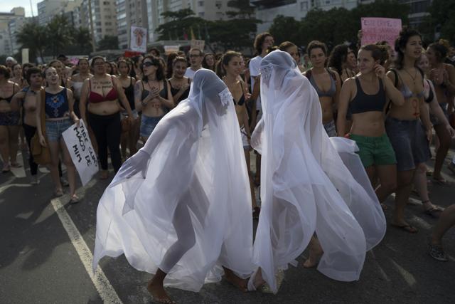 Women in veils perform during the annual Slutwalk in Rio de Janeiro, Brazil. (AP) Women in veils perform during the annual Slutwalk in Rio de Janeiro, Brazil. (AP)