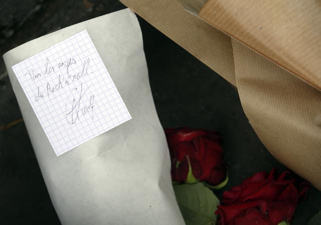 A note reading "for the Rock n roll angels" is displayed on a floral tribute near the Bataclan theatre in the 11th district of Paris. (AFP) A note reading "for the Rock n roll angels" is displayed on a floral tribute near the Bataclan theatre in the 11th district of Paris. (AFP)