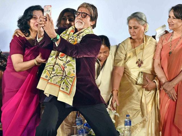 Actor Amitabh Bachchan is busy taking the selfie as West Bengal Chief Minister Mamata Banerjee, Jaya Bachchan, Sharmila Tagore, Vidya Balan and Moushumi Chatterjee look on. (PTI)