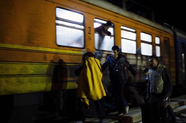 A family prepares to board a train heading to Serbia, along with other migrants and refugees. (AFP) A family prepares to board a train heading to Serbia, along with other migrants and refugees. (AFP)