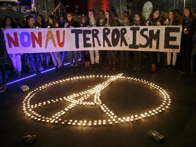 A child holds-up a hand drawn French flag as people gather on November 14, 2015 in Turin, a day after deadly attacks in Paris. (AFP Photo) A child holds-up a hand drawn French flag as people gather on November 14, 2015 in Turin, a day after deadly attacks in Paris. (AFP Photo)