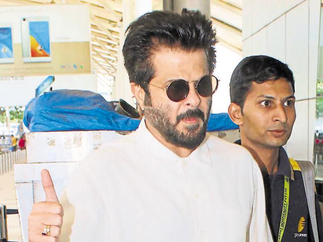 Anil Kapoor’s response to the shutterbugs at Mumbai airport. (Photo: Yogen Shah/HT)