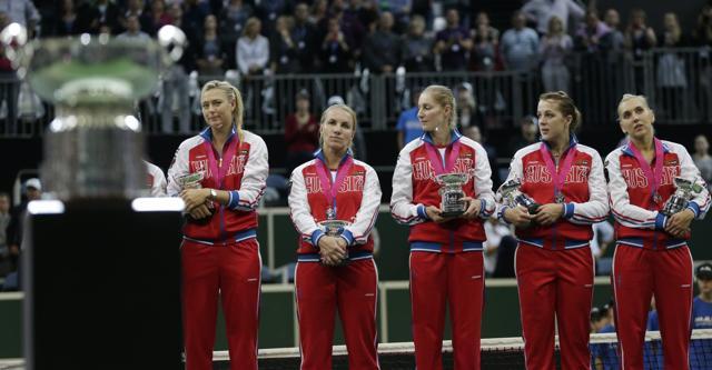 Maria Sharapova, left, participating in only her fifth Fed Cup tie, won both her singles rubbers, but it wasn’t enough to give Russia the win. (AP Photo) Maria Sharapova, left, participating in only her fifth Fed Cup tie, won both her singles rubbers, but it wasn’t enough to give Russia the win. (AP Photo)