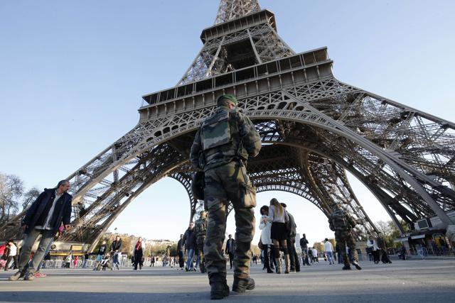 A soldier patrols in front of the Eiffel Tower in Paris. (AFP) A soldier patrols in front of the Eiffel Tower in Paris. (AFP)