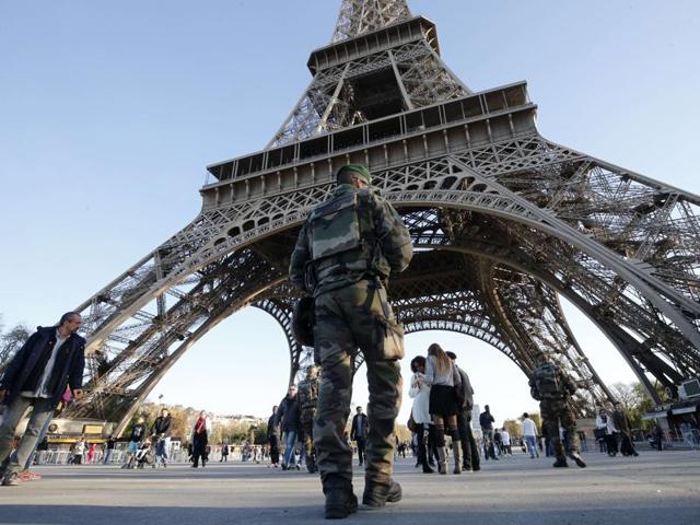 A soldier patrols in front of the Eiffel Tower in Paris. (AFP) A soldier patrols in front of the Eiffel Tower in Paris. (AFP)