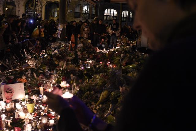 People gather at a makeshift memorial site on November 15, 2015, outside the La Belle Equipe cafe, rue de Charonne, for victims of the November 13 attacks in Paris. (AFP) People gather at a makeshift memorial site on November 15, 2015, outside the La Belle Equipe cafe, rue de Charonne, for victims of the November 13 attacks in Paris. (AFP)