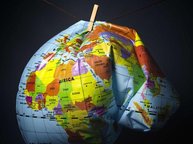 An illustration made in Paris on November 8, 2015 shows a deflated Earth globe. Earth has heated up by one degree Celsius (1.6 degrees Fahrenheit), Britain's weather office said on November 9, as greenhouse gases hit record levels just weeks before a crucial climate summit in Paris, which runs from November 30 to December 11. (AFP Photo) An illustration made in Paris on November 8, 2015 shows a deflated Earth globe. Earth has heated up by one degree Celsius (1.6 degrees Fahrenheit), Britain's weather office said on November 9, as greenhouse gases hit record levels just weeks before a crucial climate summit in Paris, which runs from November 30 to December 11. (AFP Photo)