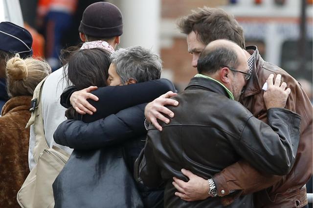 People react in front of the Paris morgue. (AP) People react in front of the Paris morgue. (AP)