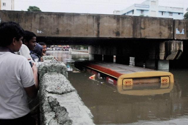 A bus submerged at Aranganathan subway after heavy rains in Chennai on Monday. (PTI) A bus submerged at Aranganathan subway after heavy rains in Chennai on Monday. (PTI)