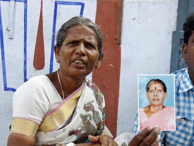 Malliga, sister, and Mohan, son of Kasthuri Munirathinam, display Kasthuri’s photograph in Chennai. Kasthuri was allegedly maimed by her employer in Saudi Arabia. (AP) Malliga, sister, and Mohan, son of Kasthuri Munirathinam, display Kasthuri’s photograph in Chennai. Kasthuri was allegedly maimed by her employer in Saudi Arabia. (AP)
