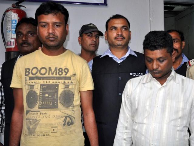 Accused Rinku Veram (left) and Yogendra in police custody in Indore on Monday. (HT photo) Accused Rinku Veram (left) and Yogendra in police custody in Indore on Monday. (HT photo)