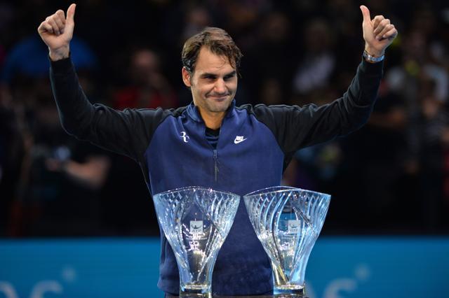Roger Federer is presented with two awards, the Fans' Favourite award, and the Stefan Edberg Sportsmanship award, following his victory over Tomas Berdych. (AFP Photo) Roger Federer is presented with two awards, the Fans' Favourite award, and the Stefan Edberg Sportsmanship award, following his victory over Tomas Berdych. (AFP Photo)