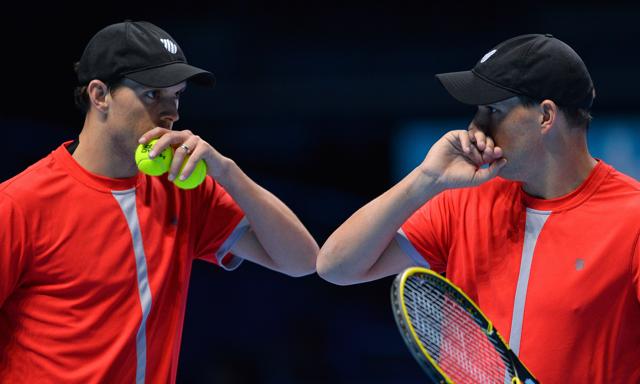 Mike Bryan, left, and Bob Bryan discuss tactics during the match. (AFP Photo) Mike Bryan, left, and Bob Bryan discuss tactics during the match. (AFP Photo)