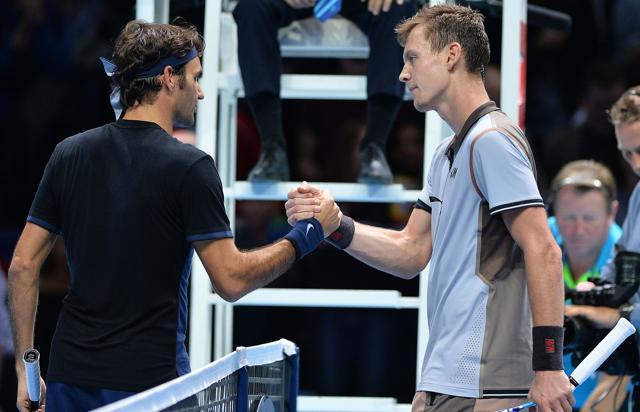 Roger Federer and Tomas Berdych shake hands at the net after the match. (AFP Photo) Roger Federer and Tomas Berdych shake hands at the net after the match. (AFP Photo)
