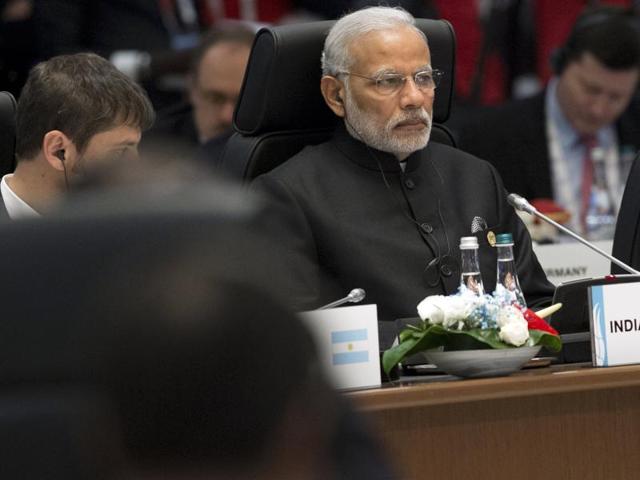 Prime Minister Narendra Modi (R) attends a working session on the Global Economy during the G20 summit in Antalya.(AFP Photo) Prime Minister Narendra Modi (R) attends a working session on the Global Economy during the G20 summit in Antalya.(AFP Photo)