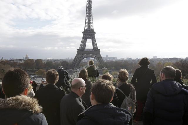 People observe a minute of silence at the Trocadero in front of the Eiffel Towe. (REUTERS) People observe a minute of silence at the Trocadero in front of the Eiffel Towe. (REUTERS)