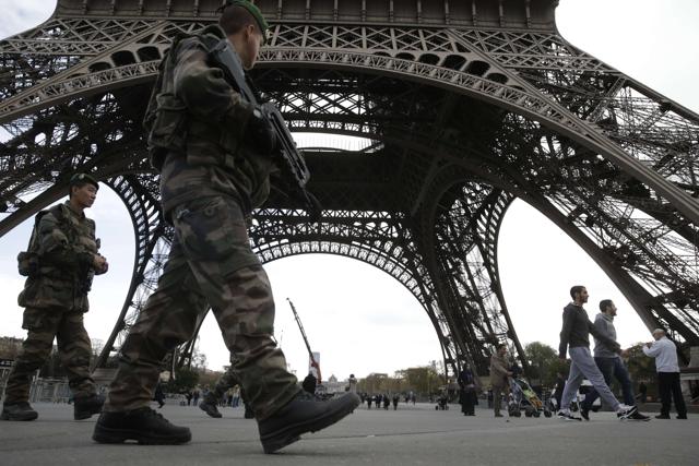 Soldiers patrol at the foot of the Eiffel Tower in Paris on November 16, 2015 three days after the terrorist attacks that left at least 132 dead and more than 350 injured. (AFP) Soldiers patrol at the foot of the Eiffel Tower in Paris on November 16, 2015 three days after the terrorist attacks that left at least 132 dead and more than 350 injured. (AFP)
