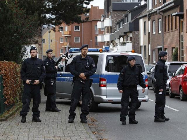 Police stand guard outside as officers investigate a residential building where arrested suspects linked to Paris attacks are thought to live, in Alsdorf near Aachen. (REUTERS) Police stand guard outside as officers investigate a residential building where arrested suspects linked to Paris attacks are thought to live, in Alsdorf near Aachen. (REUTERS)