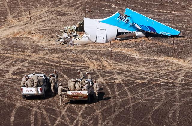 In this file photo provided by Russian Emergency Situations Ministry, Egyptian Military on cars approach a plane's tail at the wreckage of a passenger jet bound for St. Petersburg in Russia that crashed in Hassana, Egypt. (AP) In this file photo provided by Russian Emergency Situations Ministry, Egyptian Military on cars approach a plane's tail at the wreckage of a passenger jet bound for St. Petersburg in Russia that crashed in Hassana, Egypt. (AP)